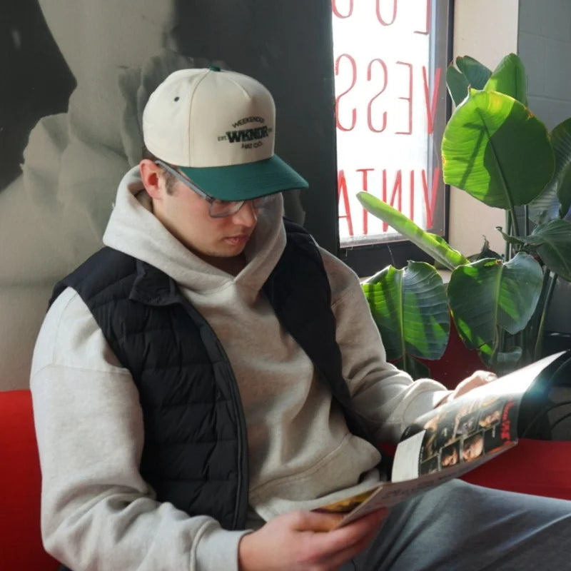 A Green Vintage Hat from Vintage Threads collection by Weekender Hat Co. being worn at Lost Vessel in Waterloo